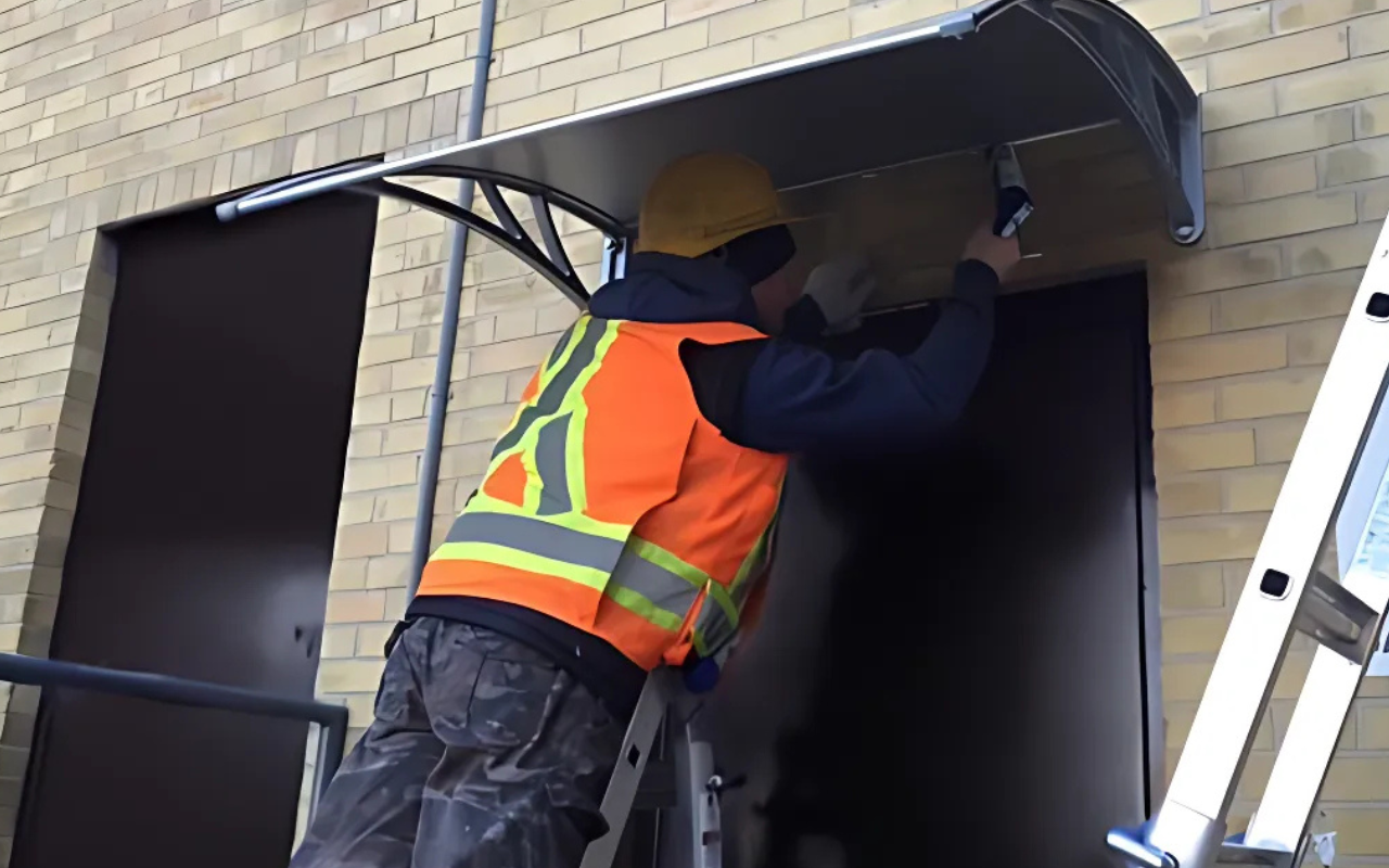When Is the Best Time to Install a Polycarbonate Awning? (Hint: Anytime!) 11 Polycarbonate awning being installed during a clear winter day - best time to install a polycarbonate awning in Canada.