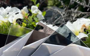 Various polycarbonate awning cover colors, including clear and tinted options, displayed side by side for comparison.